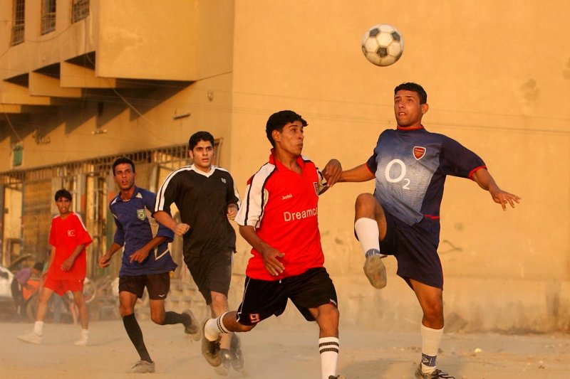 A suicide bomber set off an explosion in a town outside Baghdad, killing more than 40 people, including children at a soccer game. Many of the dead were teenage boys. Pictured: Iraqi youth play soccer at a local field in the neighborhood of Karrada on September 29, 2003 in Baghdad, Iraq. File photo by Michael Kleinfeld/UPI
