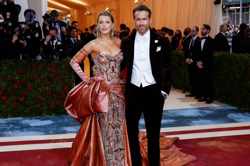 Ryan Reynolds (R) said the impending birth of his fourth child with Blake Lively has made him reconsider performing stunts. File Photo by John Angelillo/UPI