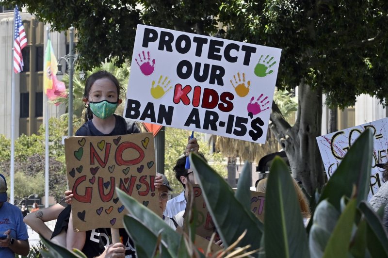 Protesters attend a March for Our Lives rally against gun violence at city hall in Los Angeles, Calif., on June 11. The initiative in North Carolina would arm schools with an AR-15 assault rifle, which would be locked in a gun safe and be available to responding police in the event of an attack. File Photo by Jim Ruymen/UPI | <a href="/News_Photos/lp/69dd4405d401571896b17de3fafc75c0/" target="_blank">License Photo</a>