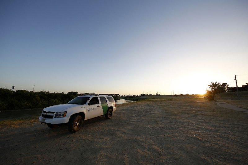 A U.S. Border Patrol agent watches the Rio Grande River at the U.S.-Mexico border in Laredo, Texas. A United Nations report shows border crossing fatalities have increased in 2017 despite a sharp drop in the overall number of attempted illegal crossings. File Photo by Aaron M. Sprecher/UPI