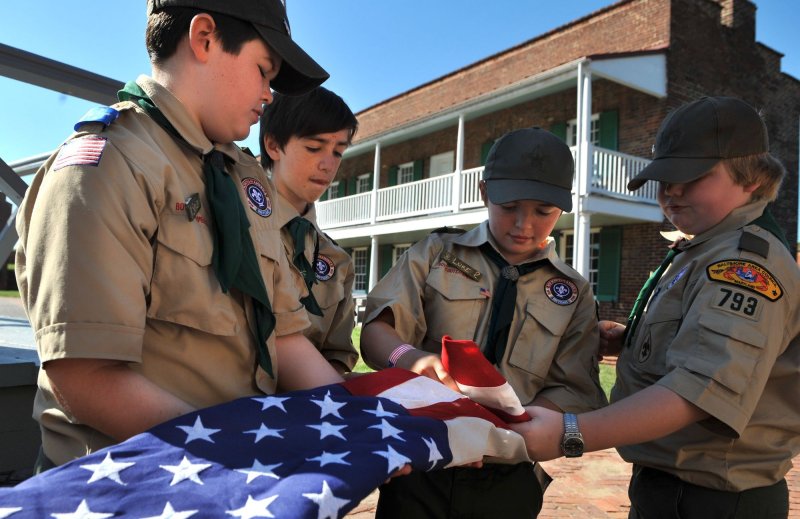 Scouts from Troop 793 of Glenelg, Maryland fold a flag during the Star-Spangled Camporee and celebration of the 100th Anniversary of the Boy Scouts of America at Fort McHenry in Baltimore on October 2, 2010. UPI/Kevin Dietsch