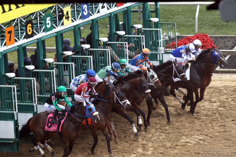 Horses break from the gate at the start of the second race prior to the 148th running of the Preakness Stakes at Pimlico Race Course in Baltimore on Saturday. Photo by Mark Abraham/UPI