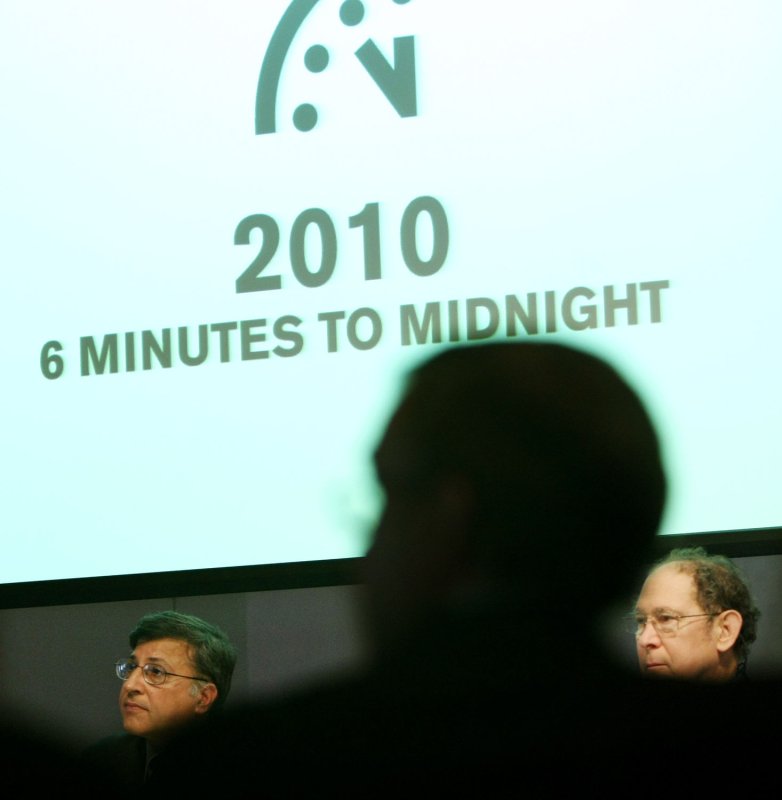 Pervez Hoodbhoy (L) and Stephen Schneider, members of the Bulletin of the Atomic Scientists, listen after the minute hand of the Doomsday Clock was symbolically moved back from five minutes to six before midnight at the New York Academy of Science on January 14, 2010 in New York. Some scientists believe that the clock's time leading up to midnight represents the world's vulnerability to catastrophe from nuclear war, climate change, and certain aspects of biotechnology. UPI /Monika Graff