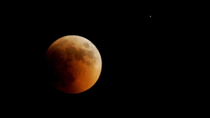 The Earth casts its shadow over the moon in a lunar eclipse as seen in Gaza, June 15, 2011. The total lunar eclipse was visible in most parts of Asia. UPI/Ismael Mohamad.