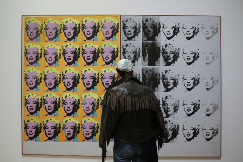 People stand among works of art by Andy Warhol depicting Marilyn Monroe at the Whitney Museum of American Art in New York City in 2018. File Photo by John Angelillo/UPI | <a href="/News_Photos/lp/7feefcd4dd4ff8497788e92e6a3e00c0/" target="_blank">License Photo</a>