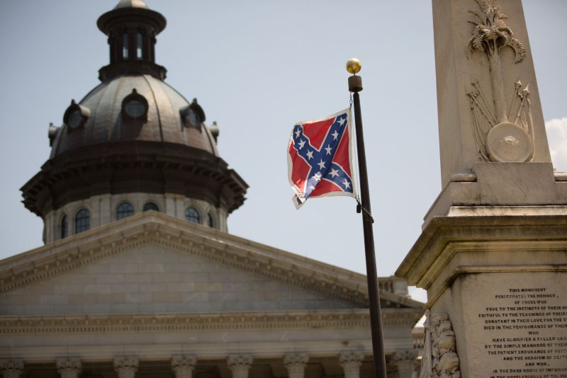 The Confederate battle flag flies outside South Carolina State House on June 24, 2015 in Columbia, South Carolina. On June 17, 2015, nine people were shot and killed inside Emanuel African Methodist Episcopal Church in Charleston, South Carolina, where Pinckney was the pastor, during Bible study. A suspect, Dylann Roof, 21, was arrested in connection with the shootings. Photo by Kevin Liles/UPI