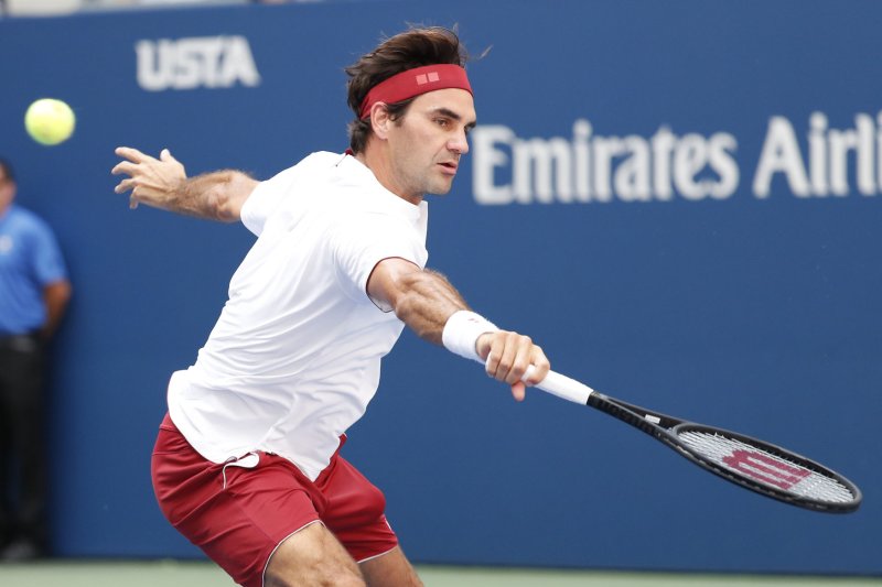 Roger Federer of Switzerland hits a volley to Benoit Paire of France in Arthur Ashe Stadium in the second round at the 2018 U.S. Open Tennis Championships on August 30, 2018 at the USTA Billie Jean King National Tennis Center in New York City. Photo by John Angelillo/UPI