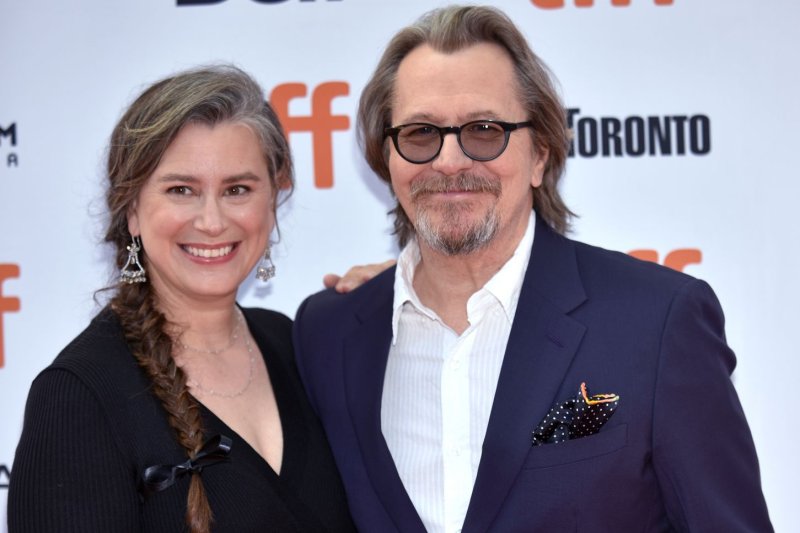 "Mank" star Gary Oldman (R) and his wife, Gisele Schmidt, arrive for the premiere of "The Laundromat" in September 2019. "Mank" is nominated for 10 awards at the Oscars. File Photo by Chris Chew/UPI | <a href="/News_Photos/lp/858e1123bcad5404b495ae6ee71a5a17/" target="_blank">License Photo</a>