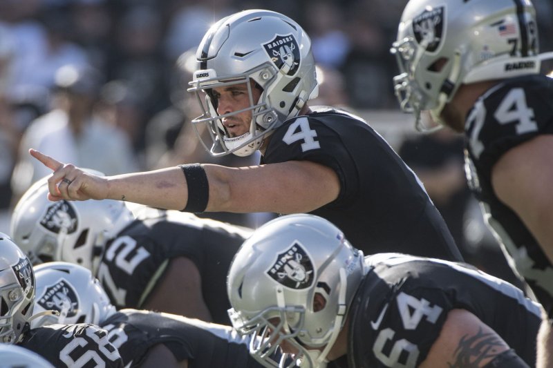 Las Vegas Raiders quarterback Derek Carr (4) completed 28 of 38 passes for 282 yards and three scores in a win over the New Orleans Saints Monday in Paradise, Nev. File Photo by Terry Schmitt/UPI | <a href="/News_Photos/lp/ee467247bfa8a974f9cbe8ed5422795a/" target="_blank">License Photo</a>