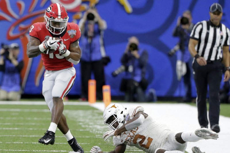 Former Georgia Bulldogs running back Elijah Holyfield (L) will compete for a spot on the Carolina Panthers' roster this off-season. File Photo by AJ Sisco/UPI