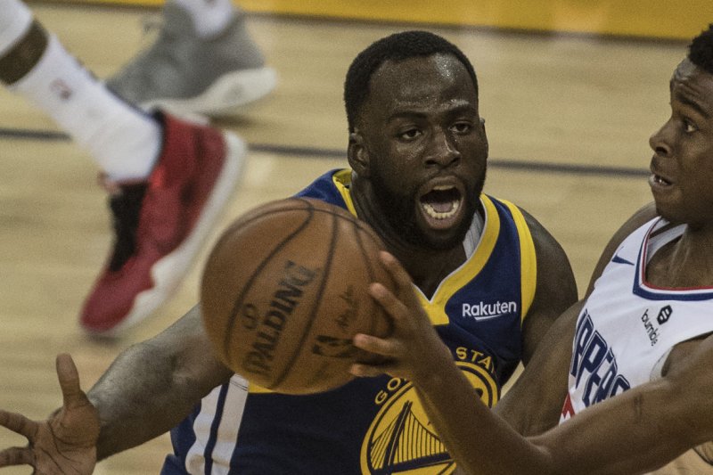 Golden State Warriors forward Draymond Green (L), shown April 24, 2019, took issue with Thursday's postponement and directed a lengthy post on social media at the NBA. File Photo by Terry Schmitt/UPI
