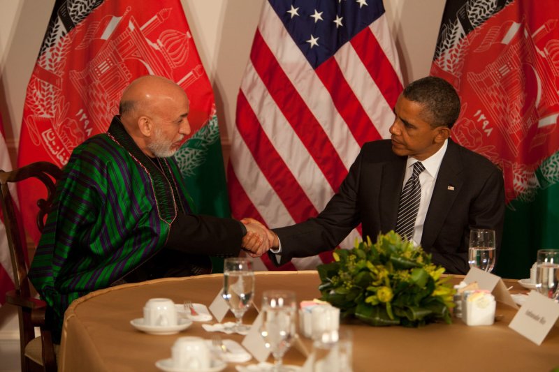 President Obama and Afghan President Hamid Karzai reaffirmed their commitment to shifting security to Afghan forces by the end of 2014, the White House said. UPI/Allan Tannenbaum/Pool