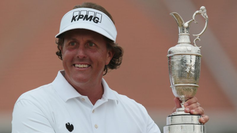 USA's Phil Mickelson holds the Claret Jug after winning the Open Championship at Muirfield on the fourth day of the 2013 Open Championship in Muirfield, Scotland on July 21 , 2013.Mickelson won with a score of three under par. UPI/Hugo Philpott