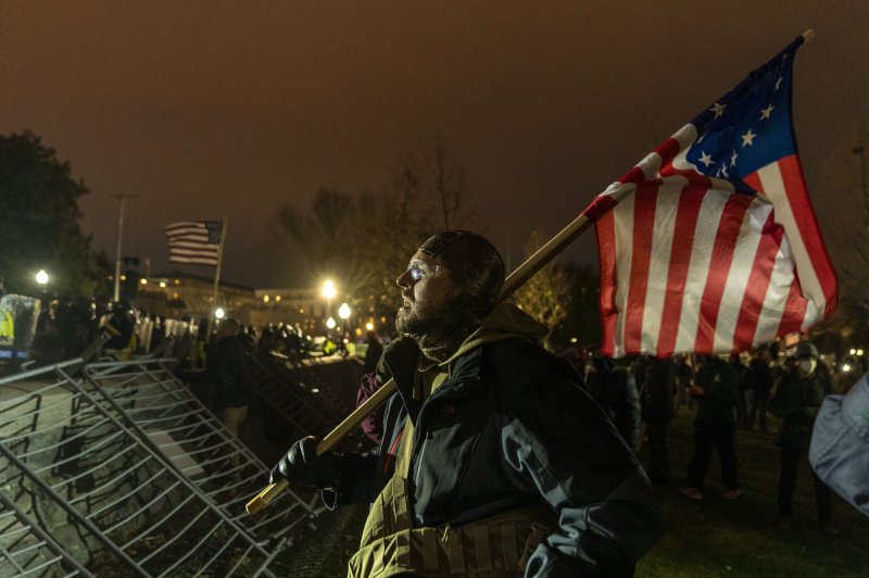 Pro-Trump rioters breach the security perimeter and penetrate the U.S. Capitol to protest against the Electoral College vote count that would certify President-elect Joe Biden as the winner in Washington, D.C., on Jan. 6. Photo by Ken Cedeno/UPI | <a href="/News_Photos/lp/b1d15394d792d9a27a84c065dabf8f53/" target="_blank">License Photo</a>