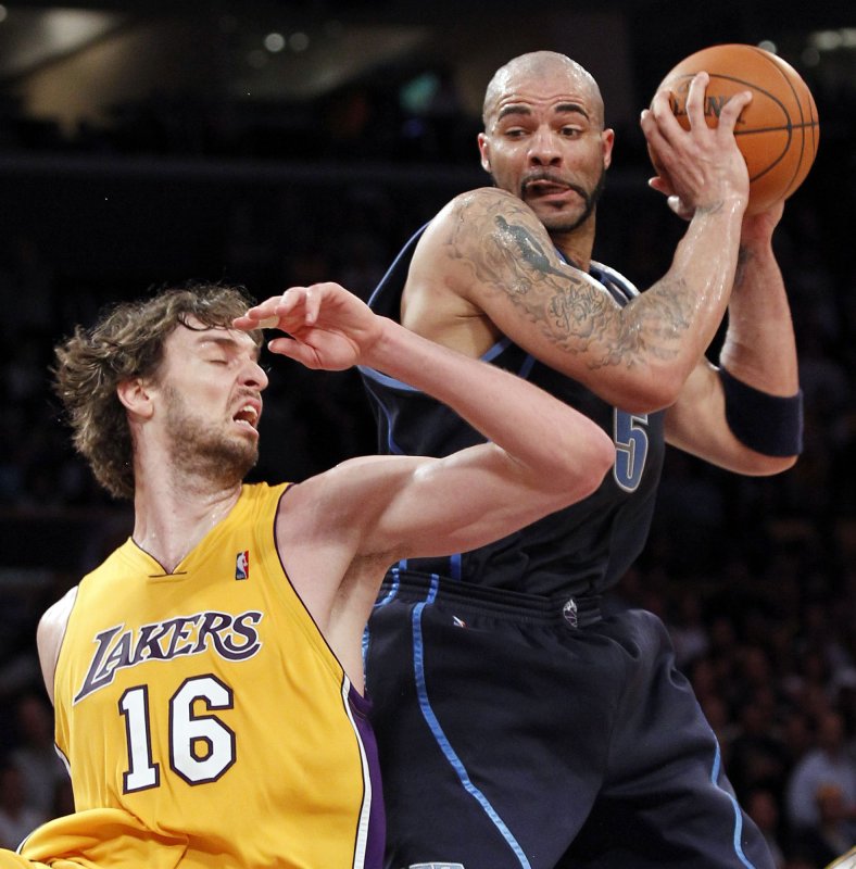 Carlos Boozer, then with the Utah Jazz, right, grabs a rebound over Lakers forward Pau Gasol (16) during Game 2 of their Western Conference semifinal series at Staples Center in Los Angeles, May 4, 2010. UPI Photo/Lori Shepler | <a href="/News_Photos/lp/1ba490efb23c580ae215d88507ae74ef/" target="_blank">License Photo</a>