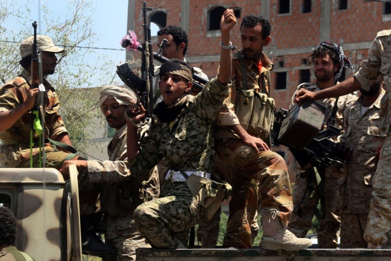 Militants loyal to Yemen's President Abed Rabbo Mansour Hadi take their positions in Taiz, Yemen, March, 30, 2015. Photo by Anees Mahyoub/UPI. | <a href="/News_Photos/lp/08ac272a803565559bca1ea8006f7627/" target="_blank">License Photo</a>