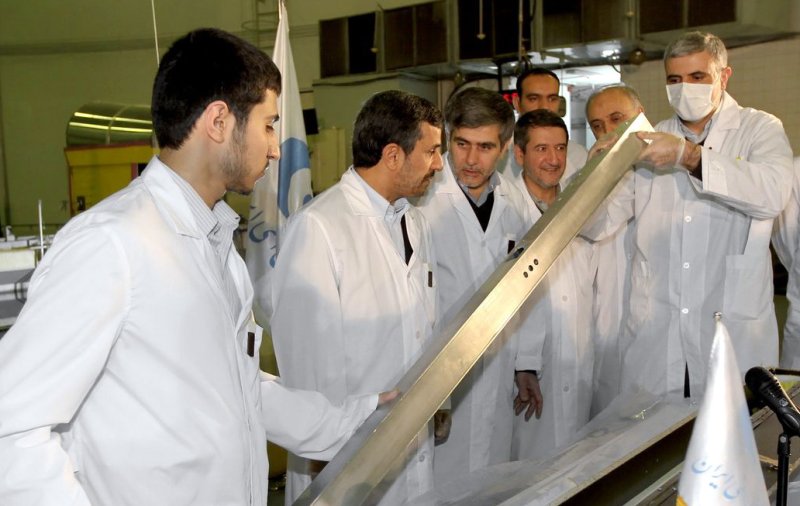 A handout picture released by the Iranian President Mahmoud Ahmadinejad’s official website shows Ahmadinejad (2nd,L) and Atomic Energy Organization Chief Fereidoun Abbasi (3rd,L) visiting Tehran’s nuclear reactor during the unveiling ceremony on February 15, 2012 in Tehran, Iran. Iran simultaneously unveiled three new nuclear projects on Wednesday. UPI