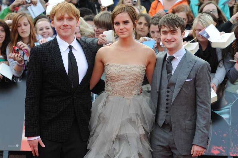 Left to right, Rupert Grint, Emma Watson and Daniel Radcliffe attends the premiere of "Harry Potter And The Deathly Hallows Part 2" in July 2011. May 2 marks International Harry Potter Day. File Photo by Rune Hellestad/UPI