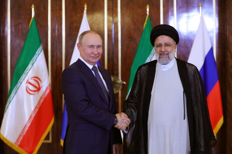 Russian President Vladimir Putin (R) and Iranian President Ebrahim Raisi shake hands following a meeting in Tehran, Iran, on Tuesday, July 19. On Wednesday, British intelligence said Russia is increasingly relying on Iran and North Korea to buy weapons to continue its war in Ukraine. File Photo by Iranian Presidential Office/UPI | <a href="/News_Photos/lp/385ab633d7e7f69b3d6f36d359c02e93/" target="_blank">License Photo</a>