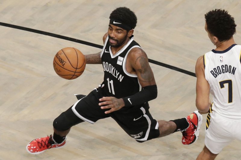 The Brooklyn Nets suspended Kyrie Irving (L) for at least five games on Thursday after the Nets guard posted a link to an anti-Semitic film and refused to condemn or acknowledge the hateful material in the film. File Photo by John Angelillo/UPI