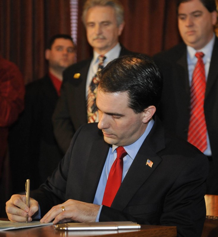 Governor Scott Walker signs a ceremonial bill at the Wisconsin State Capitol on March 11, 2011 in Madison, Wisconsin. UPI/David Banks | <a href="/News_Photos/lp/6a1b120f5c8851fdd89fb50118221449/" target="_blank">License Photo</a>
