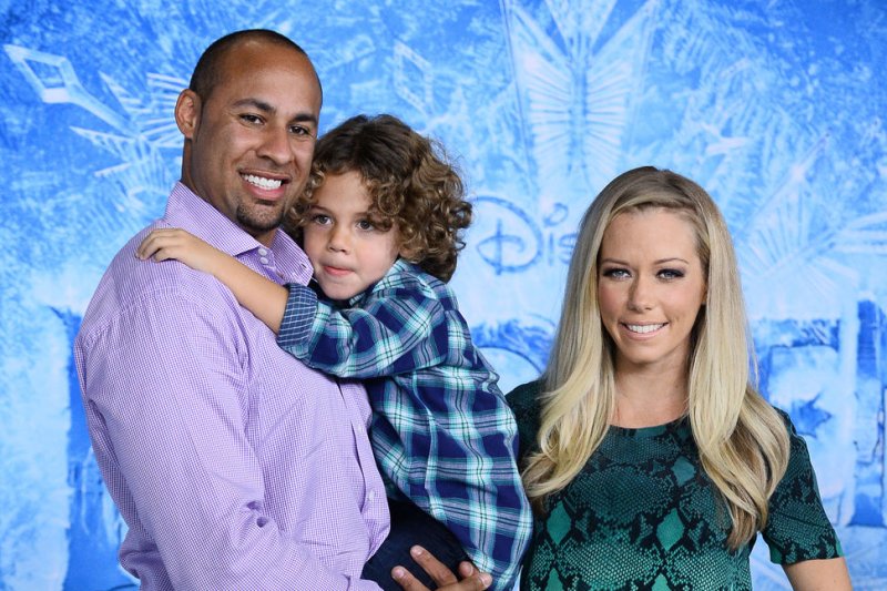 Athlete Hank Baskett and his wife, TV personality Kendra Wilkinson attend the premiere of the animated motion picture musical comedy "Frozen" with their son Hank Baskett IV at the El Capitan Theatre in the Hollywood section of Los Angeles on November 19, 2013. Storyline: Fearless optimist Anna teams up with Kristoff in an epic journey, encountering Everest-like conditions, and a hilarious snowman named Olaf in a race to find Anna's sister Elsa, whose icy powers have trapped the kingdom in eternal winter. UPI/Jim Ruymen