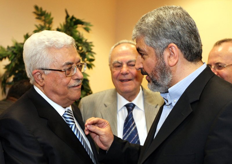 Hamas leader Khaled Meshaal (R) talks with President Mahmoud Abbas (L) during their meeting in Cairo May 4, 2011. The rival factions, Fatah and Hamas, signed a reconciliation accord in Cairo after reaching common ground against Israeli occupation and peace efforts. Mashaal said they had a 'common goal; a Palestinian state with full sovereignty on the 1967 borders with Jerusalem as the capital'. Israeli Prime Minister Benjamin Netanyahu claimed that the reconciliation between the factions as a 'blow to peace', but the US declined to make any comment. UPI\ Mohammed Hosam