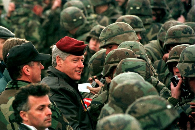 President Bill Clinton dons the red beret of the Red Eagles as he speaks with U.S. Troops stationed as part of a NATO peacekeeping force on January 13, 1996, in Tuzla, Bosnia. On April 4, 1949, representatives of 12 nations gathered in Washington to sign the North Atlantic Treaty, creating the NATO alliance. File Photo by Mike Marucci/UPI | <a href="/News_Photos/lp/efa3116b6b8dfb56d7f1fdb298bd78b0/" target="_blank">License Photo</a>
