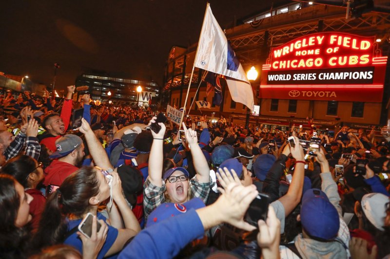 Chicago Cubs fans celebrate outside the Wrigley Field after the Game 7 of the World Series win against the Cleveland Indians on November 2 in Chicago. On August 8, 1988, the first night game at Chicago's Wrigley Field was played. File Photo by Kamil Krzaczynski/UPI | <a href="/News_Photos/lp/ac7d9cb7013accf943386888e78ec982/" target="_blank">License Photo</a>