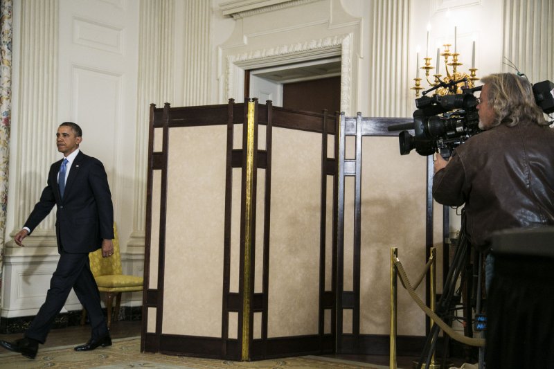 U.S. President Barack Obama walks to the podium to make a statement announcing an interim agreement on Iranian nuclear power that was reached in negotiations between Iran and six world powers, from the State Dining Room at the White House on November 23, 2013 in Washington, D.C. A major sticking point in the negotiations has been Iran's insistence on it's right to enrich uranium. UPI/T.J. Kirkpatrick/Pool
