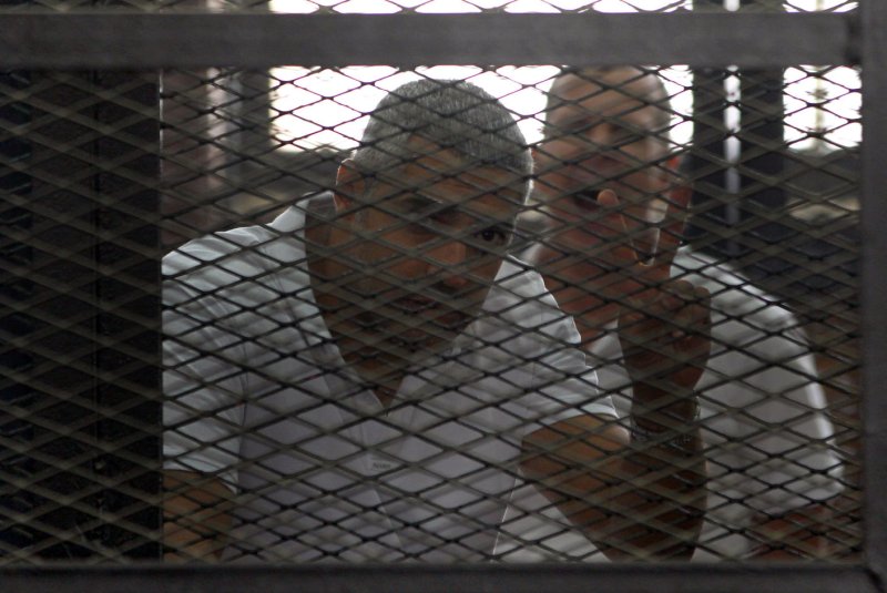 Al-Jazeera journalists released from prison pending retrial