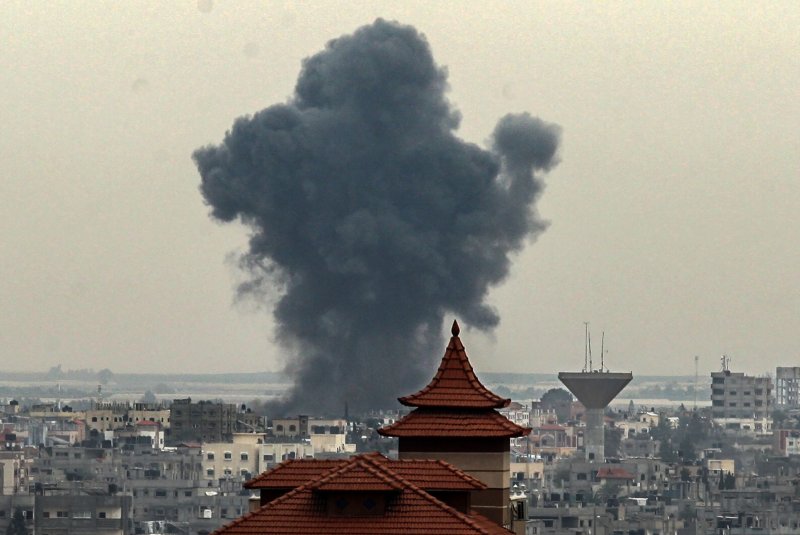 Smoke billows after an Israeli strike on Rafah in the southern Gaza Strip on Friday. The IDF said it would expand ground operations in Gaza on Friday evening. Photo by Ismael Mohamad/UPI