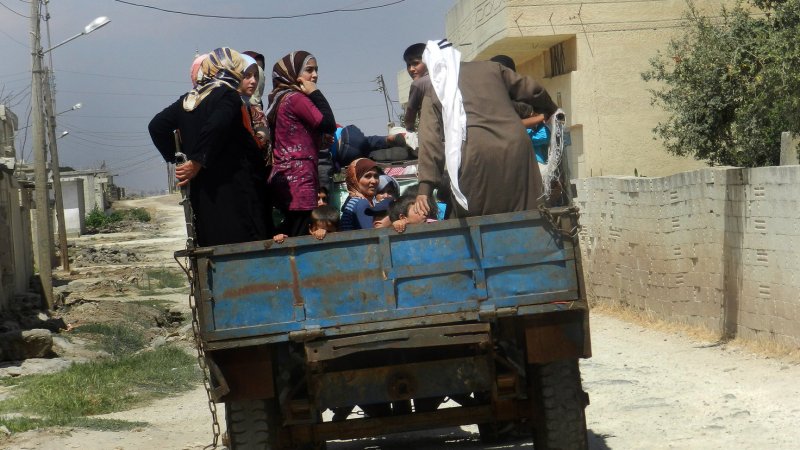 Syrian civilians flee in a vehicle at Houla near Homs, September 9, 2012. UPI | <a href="/News_Photos/lp/d882b262011273e3c4316f6dea547b36/" target="_blank">License Photo</a>