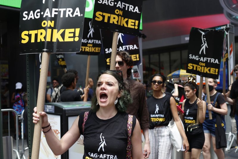 Members of the Writers Guild of America East are joined by SAG-AFTRA members and actors. Photo by John Angelillo/UPI