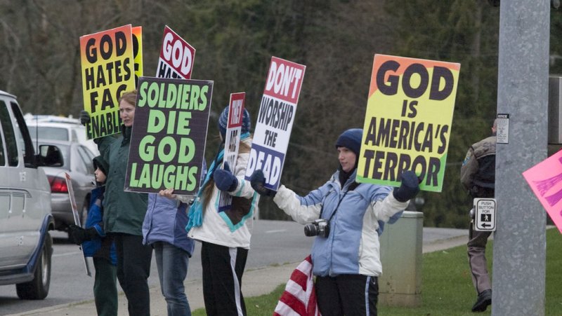Westboro Baptist Church members protest the funeral of Sgt. 1st Class Johnny Walls on November 30, 2007. The Westboro Baptists Church from Topeka, gained notoriety by demonstrating at military funerals across the country, claiming God is killing troops in Iraq and Afghanistan to punish the United States for tolerating homosexuality. Walls died on November 2 from wounds suffered when insurgents attacked his unit with small-arms fire while serving in Afghanistan. (File/UPI Photo/Jim Bryant) | <a href="/News_Photos/lp/ed09cfb2eea210837469804a2ff38fde/" target="_blank">License Photo</a>