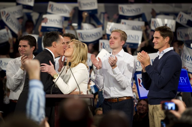 Republican presidential candidate Mitt Romney kisses his wife Ann and is joined on stage by his family as he holds an election night rally after winning the New Hampshire primary on the campus of Southern New Hampshire University in Manchester, New Hampshire on January 10, 2012. UPI/Kevin Dietsch