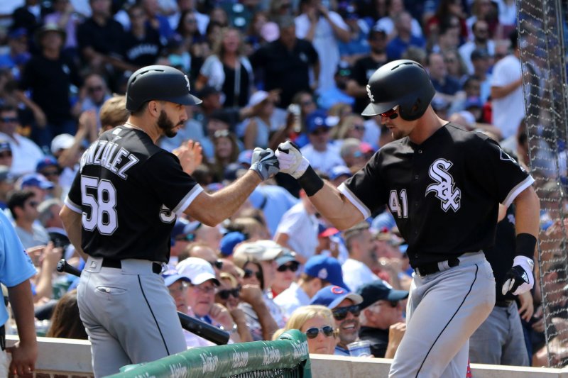 Chicago White Sox Adam Engel is greeted by pitcher Miguel Gonzalez after hitting a home run during the sixth inning of a game against the Chicago Cubs at Wrigley Field in Chicago Illinois on July 24, 2017. Photo by Aaron Josefczyk/UPI