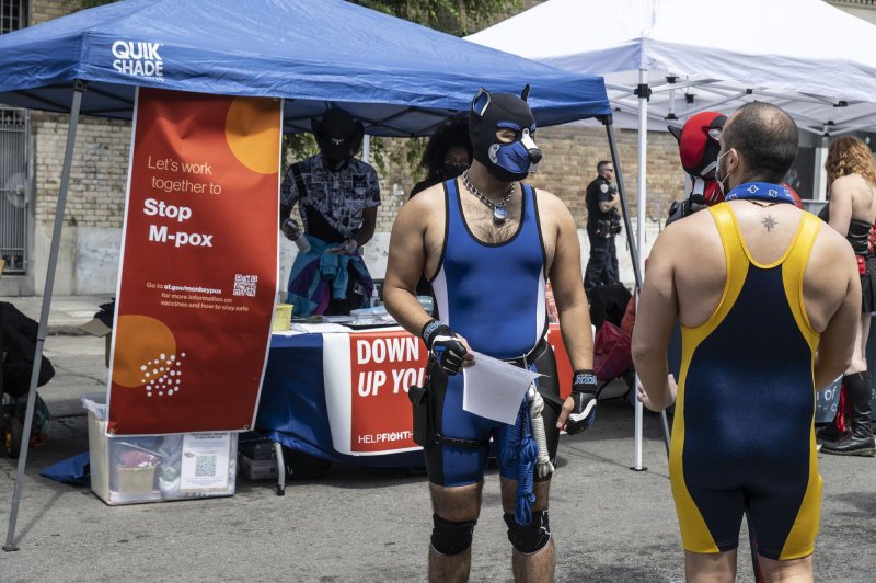 A booth offers information on monkeypox at a fetish and leather festival in San Francisco on July 31. Photo by Terry Schmitt/UPI