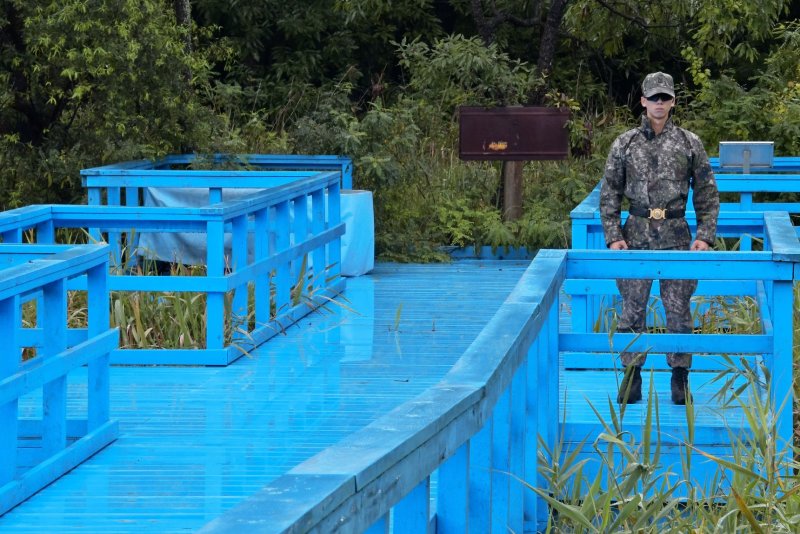 A South Korean soldier stands guard on the Foot Bridge at the joint security area in the demilitarized zone near Paju, South Korea.&nbsp; File Photo by Keizo Mori/UPI