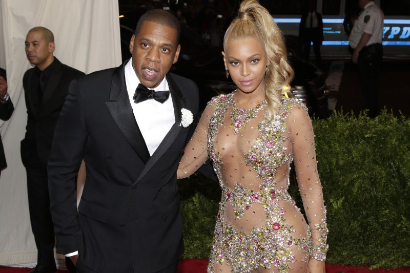 Jay Z (L) and Beyonce arrive on the red carpet at the Costume Institute Benefit at The Metropolitan Museum of Art celebrating the opening of China: Through the Looking Glass on May 4, 2015. Jay Z's streaming service Tidal is partnering with wireless carrier Sprint. File Photo by John Angelillo/UPI | <a href="/News_Photos/lp/2cf7b595f005b4b0d500da078e21d97b/" target="_blank">License Photo</a>