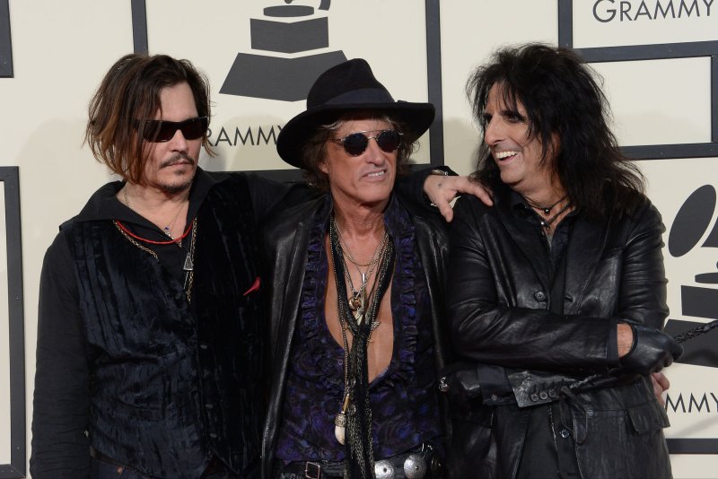 Left to right, Johnny Depp, Joe Perry and Alice Cooper arrive for the 58th annual Grammy Awards held at Staples Center in Los Angeles in 2016. File Photo by Jim Ruymen/UPI