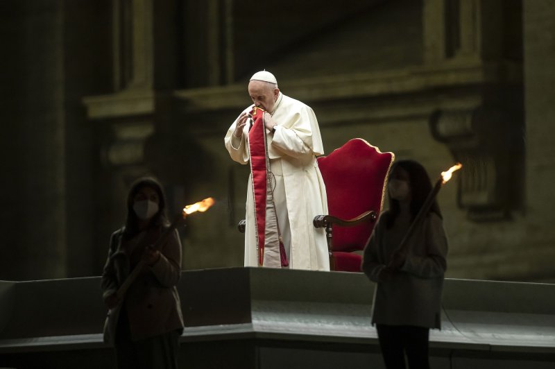 Pope Francis presides over Good Friday services in St. Peter's Square at the Vatican on Friday. Photo by Stefano Spaziani/UPI