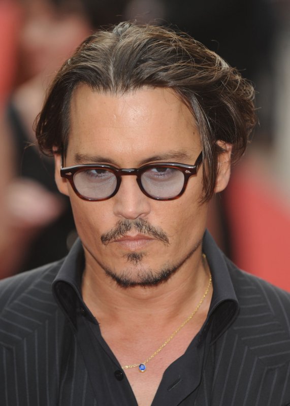 American actor Johnny Depp attends the European premiere of "Public Enemies" at Empire, Leicester Square in London on June 29, 2009. (UPI Photo/Rune Hellestad)