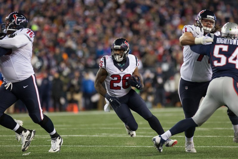 Former Houston Texans running back Lamar Miller (26) was a Pro Bowl selection in 2018. He missed the entire 2019 season because of a torn ACL. File Photo by Matthew Healey/UPI | <a href="/News_Photos/lp/9bc40a8b81cccf26b88ad32012df7850/" target="_blank">License Photo</a>