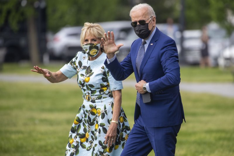 President Joe Biden and first lady Jill Biden walk to board Marine One on the Ellipse of the White House as he traveled to Georgia for a drive-in rally marking his 100th day in office. Photo by Shawn Thew/UPI | <a href="/News_Photos/lp/290f3a931284ca45a984641a78a583c3/" target="_blank">License Photo</a>