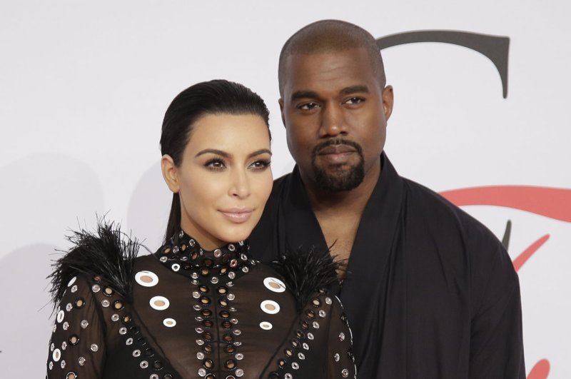 Kim Kardashian (L) and husband Kanye West at the CFDA Fashion Awards on June 1. The couple spent Fourth of July with daughter North West in New York. File photo by John Angelillo/UPI