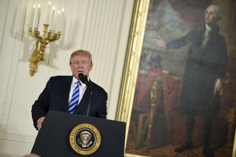 President Donald Trump Tuesday announced he signed a directive ordering Attorney General Jeff Sessions to craft legislation banning "bump stocks" and other devices that turn semi-automatic firearms into automatic weapons. Photo by Leigh Vogel/UPI