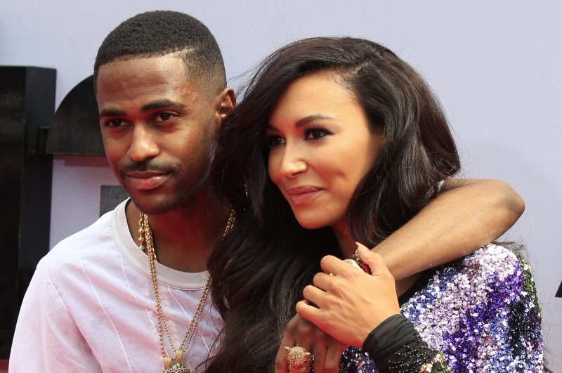 Big Sean (L) and actress Naya Rivera attend the BET Awards on June 30, 2013. Big Sean called out Rivera and former labelmate Kid Cudi in a new song. File Photo by Alex Gallardo/UPI