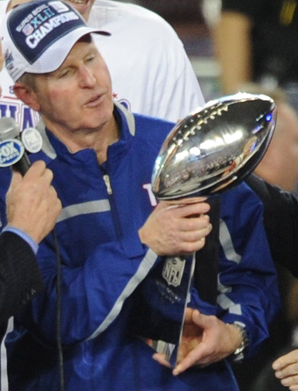 New York Giants head coach Tom Coughlin admires the Lombardi Trophy his team earned at Super Bowl XLII at University of Phoenix Stadium in Glendale, Arizona on February 3, 2008. The Giants defeated the Patriots 17-14, leaving the Patriots with a disappointing 18-1 record. (UPI Photo/Ian Halperin)