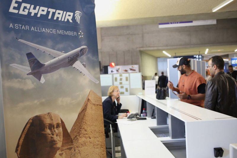 People line up to speak to a ground hostess at the EgyptAir counter in the departure hall of Roissy-Charles de Gaulle's airport, on the outskirts of Paris, on May 19, 2016. Authorities reportedly said Wednesday that investigators had located the jet's wreckage in the Mediterranean. Photo by Eco Clement/UPI